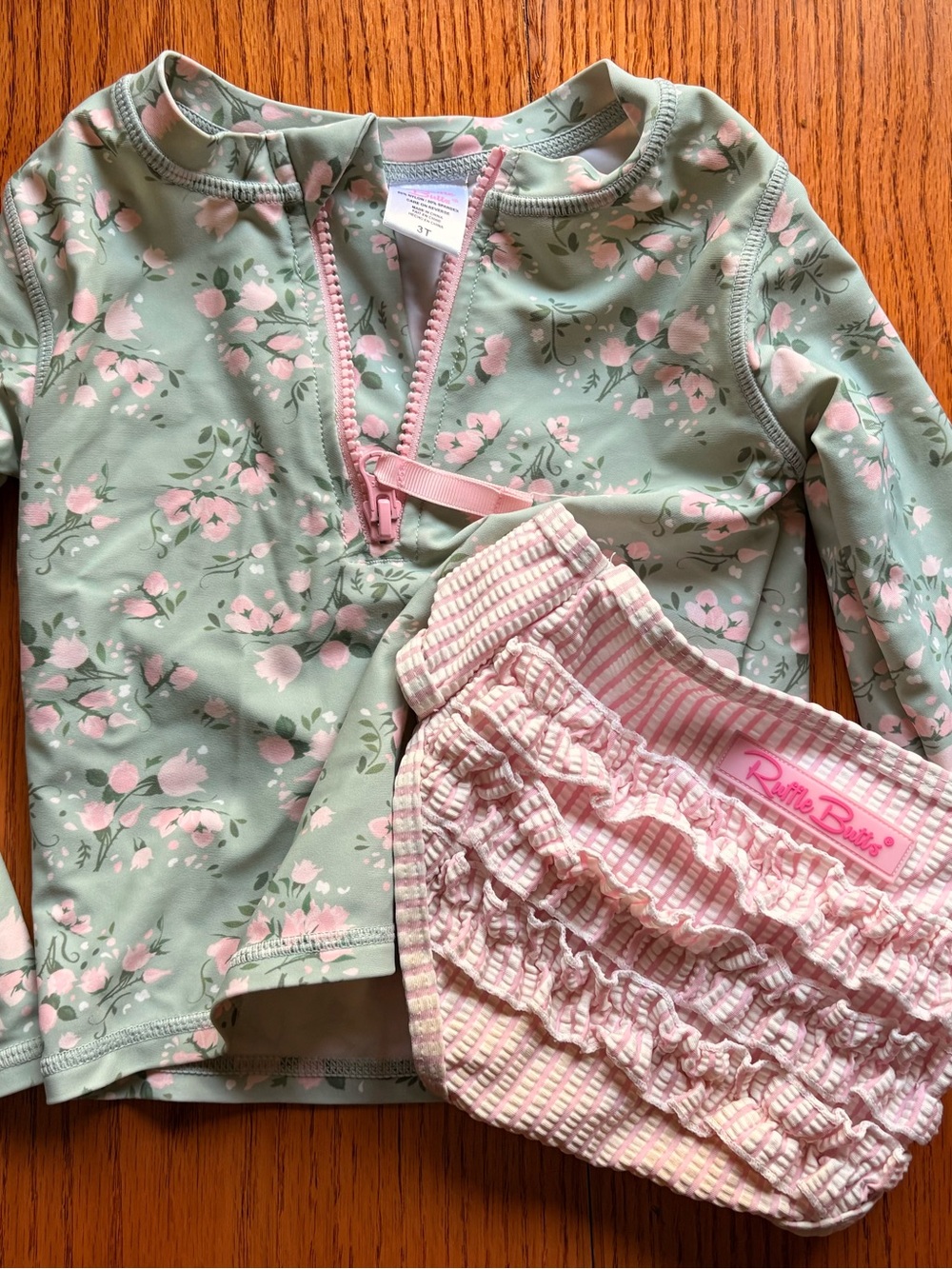 Ruffle Butts Green Floral Rash Guard with Pink Ruffle Swim Bottoms
